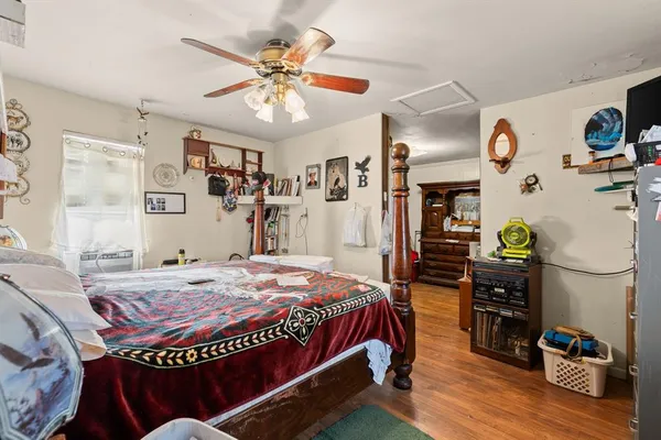 a bed room with a bed and a chandelier