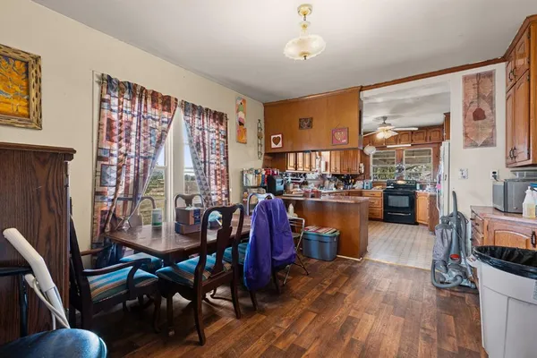 a view of a dining room with furniture and chandelier