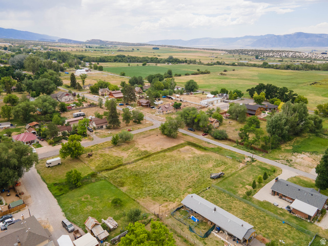 74 West Ctr Spring Spring City, UT 84662 - Photo 7 of 15 Rural landscape featuring diverse residential properties and extensive open fields, bordered by distant mountains