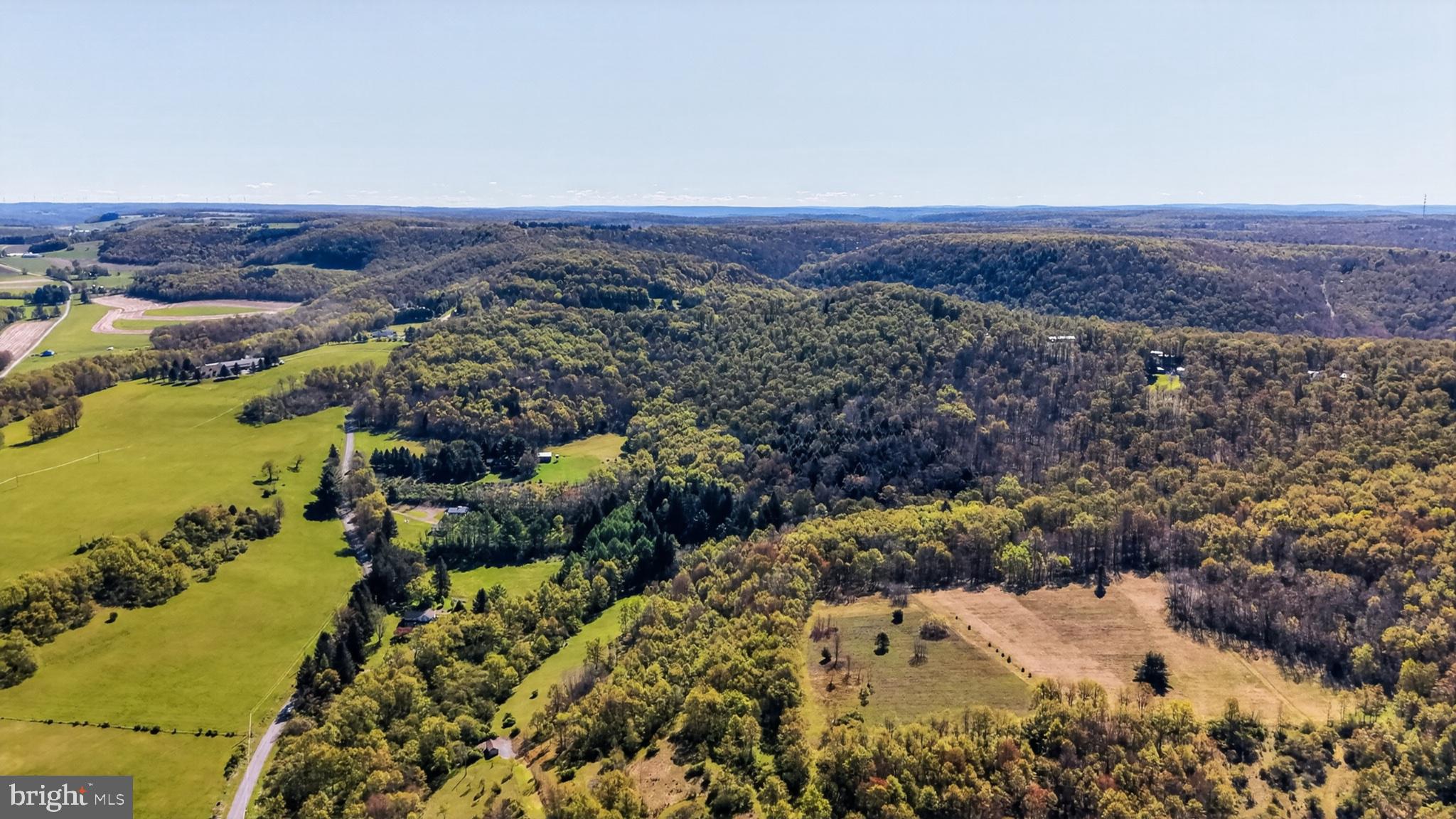 259 A A-Frame Road Coudersport, PA 16915 - Photo 88 of 130 Lush hills embrace serene landscapes.