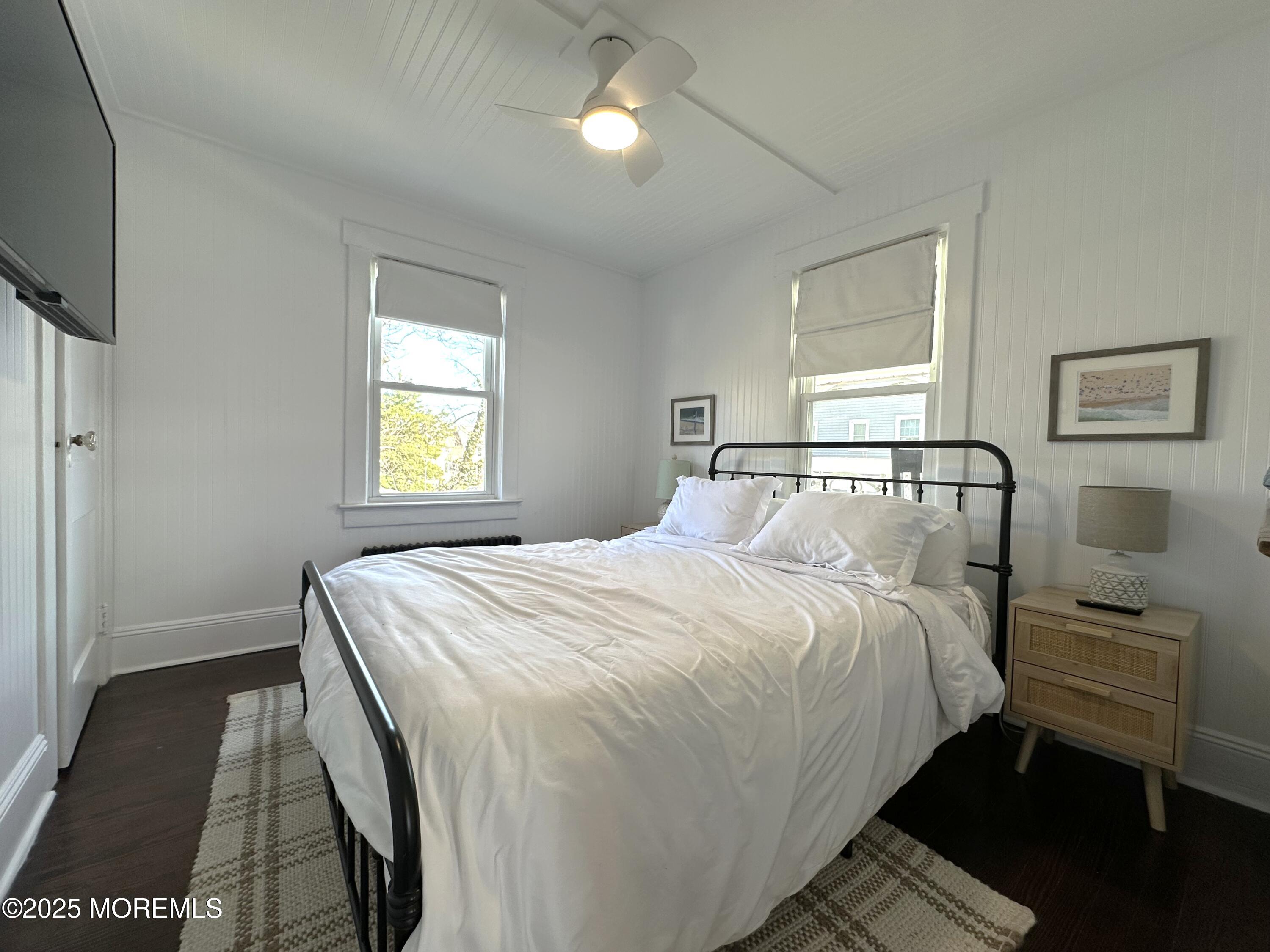 506 7th Avenue, Unit REAR Belmar, NJ 07719 - Photo 11 of 16 a bedroom with a bed and a window