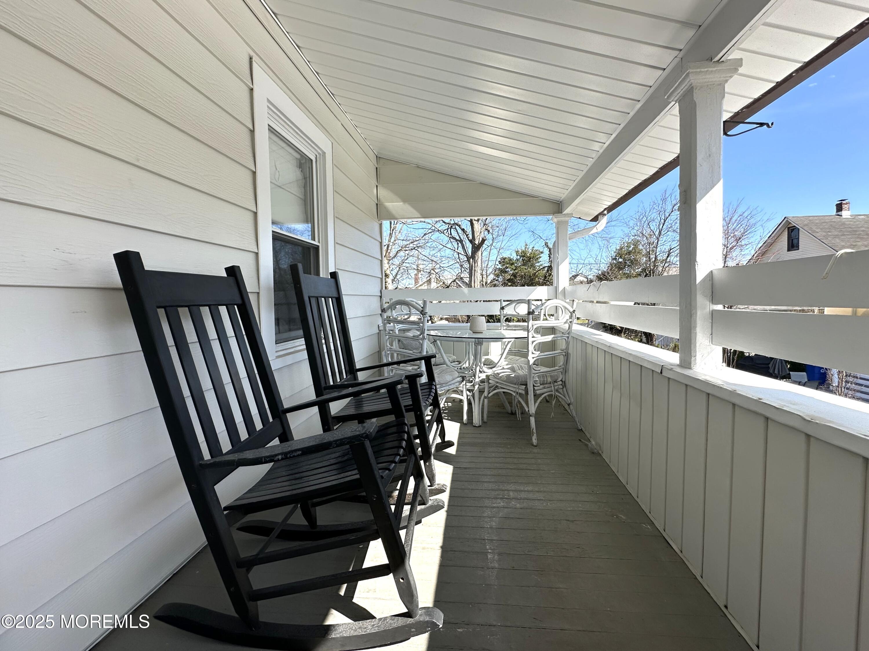506 7th Avenue, Unit REAR Belmar, NJ 07719 - Photo 13 of 16 a view of a chairs and table in the balcony