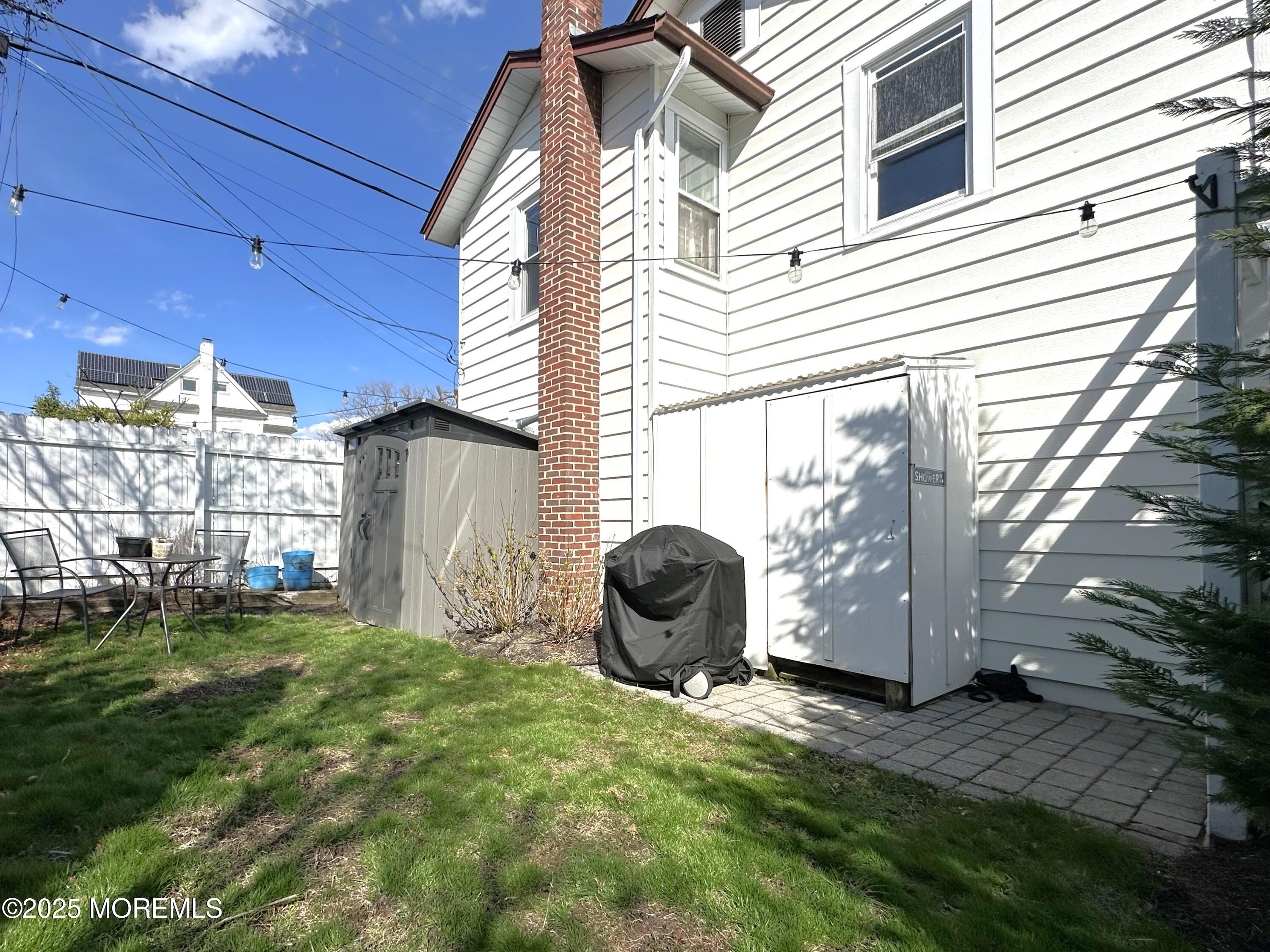 506 7th Avenue, Unit REAR Belmar, NJ 07719 - Photo 15 of 16 a view of a backyard with plants and a tub
