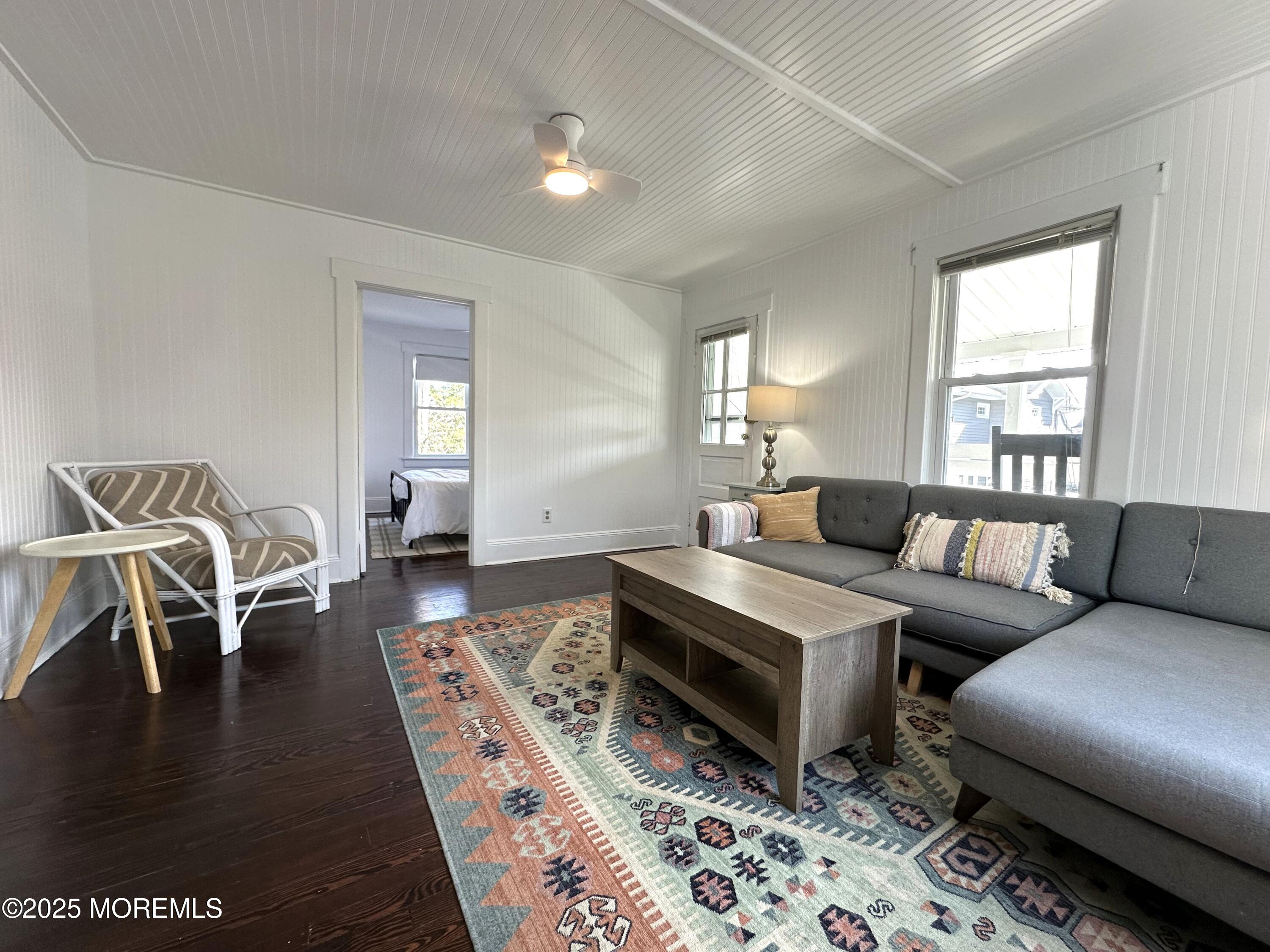 506 7th Avenue, Unit REAR Belmar, NJ 07719 - Photo 2 of 16 a living room with furniture and a window
