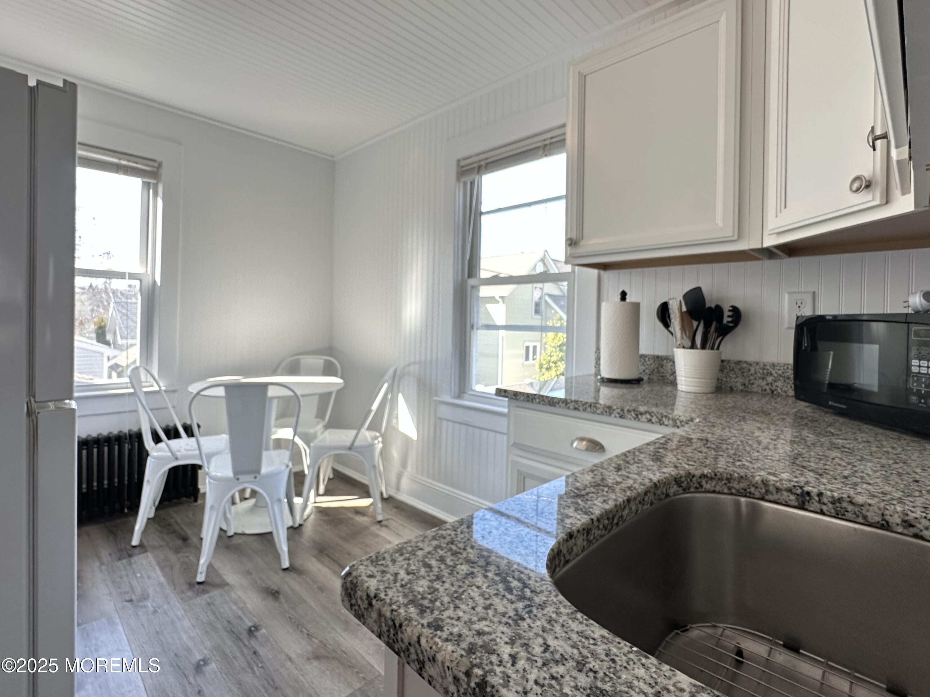 506 7th Avenue, Unit REAR Belmar, NJ 07719 - Photo 5 of 16 a living room with furniture and a window