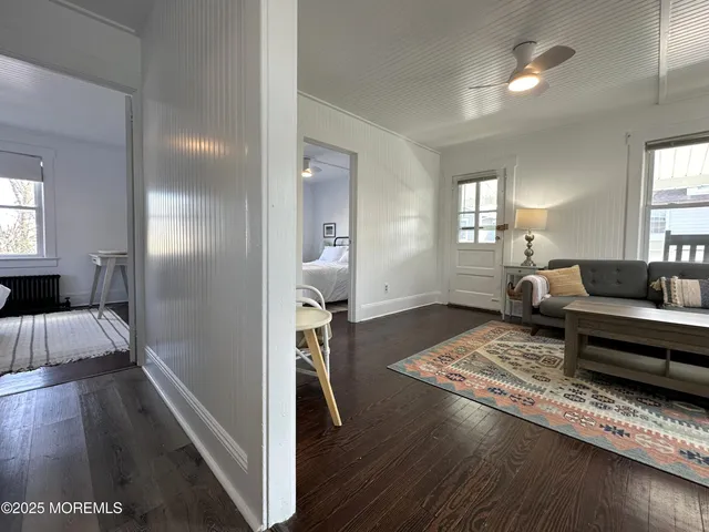 a living room with furniture and a rug