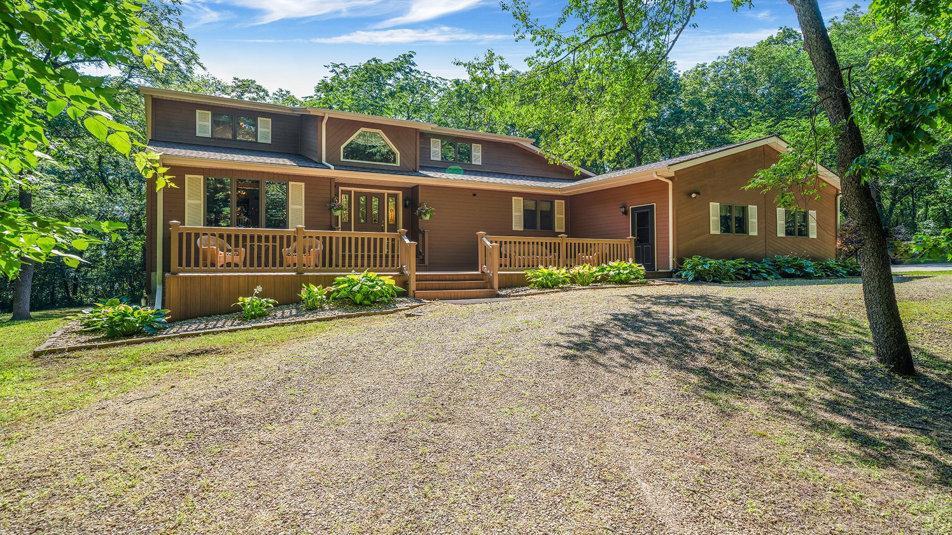 5221 West Edgewood Road Dixon, IL 61021 - Photo 1 of 43 a front view of a house with garden