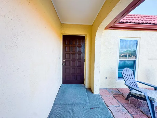 a view of front door with wooden door