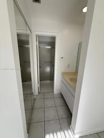 a bathroom with a sink and a shower