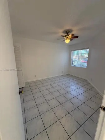 a view of empty room with windows