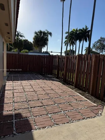 a view of a backyard of the house