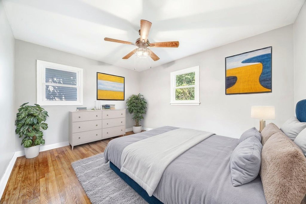 15417 Cherry Lane Markham, IL 60428 - Photo 11 of 24 a bedroom with a bed and a painting on the wall