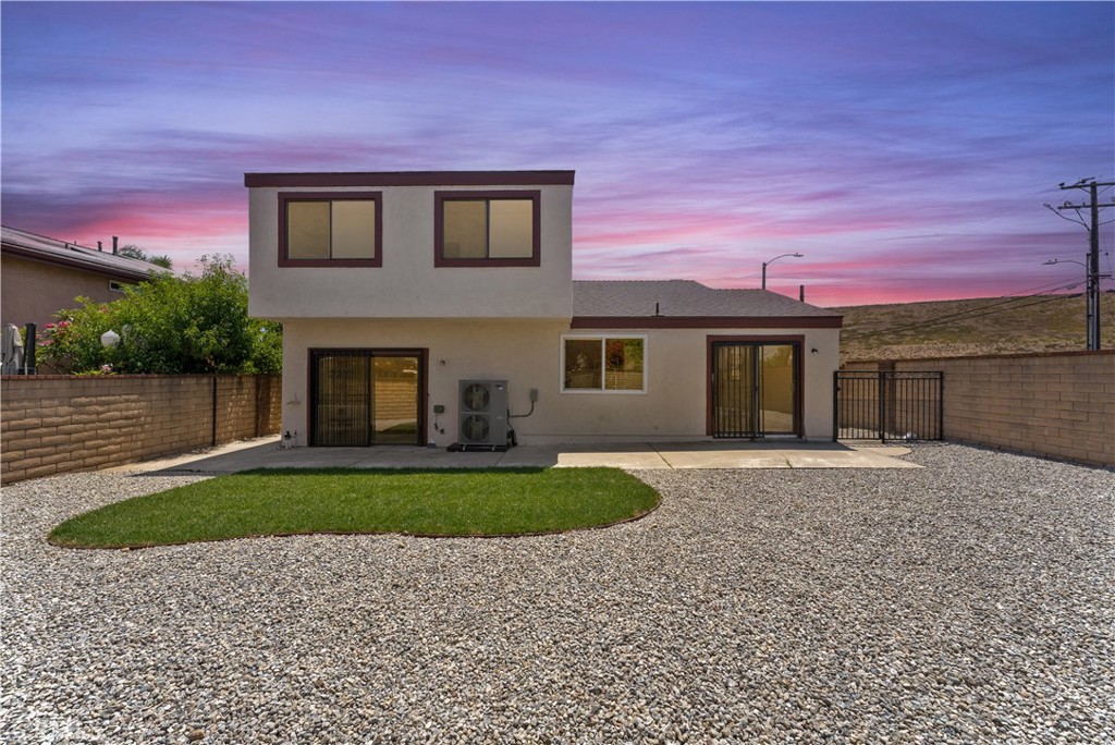 715 Metro Drive Monterey Park, CA 91755 - Photo 2 of 4 a front view of a house with a yard and a garage