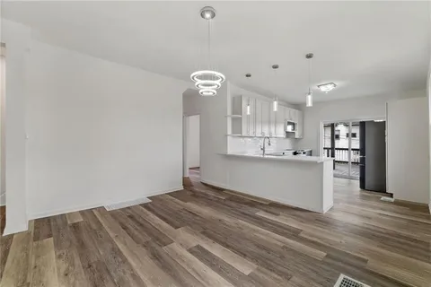 a view of kitchen and wooden floor