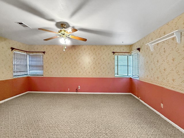 412 Neal Street Jasper, TX 75951 - Photo 16 of 22 a view of room with a ceiling fan and window