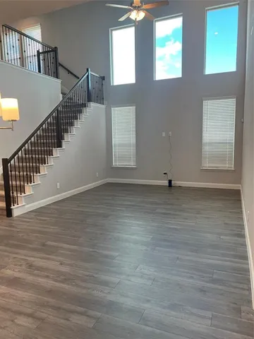 a view of an entryway with wooden floor