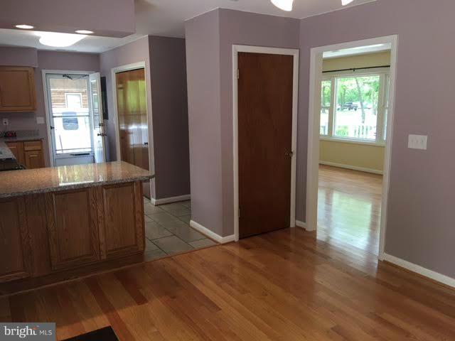 21095 Tanyard Road Preston, MD 21655 - Photo 6 of 30 Island Bar Between Kitchen and Dining