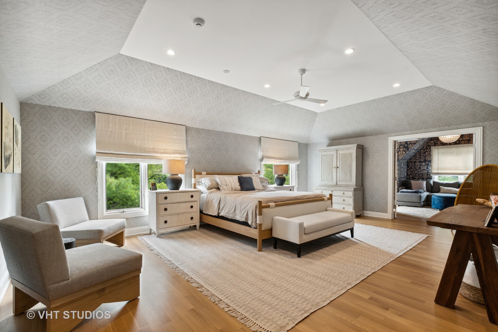 37 Sheridan Road Highland Park, IL 60035 - Photo 28 of 48 a spacious bedroom with a bed a couch and a large window