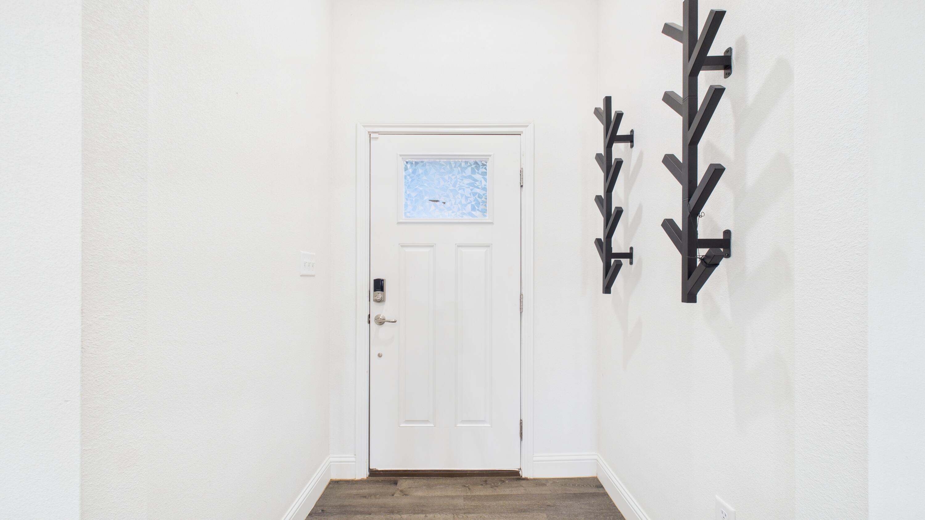 7107 23rd Street Lubbock, TX 79407 - Photo 11 of 49 a view of a hallway with wooden floor and closet