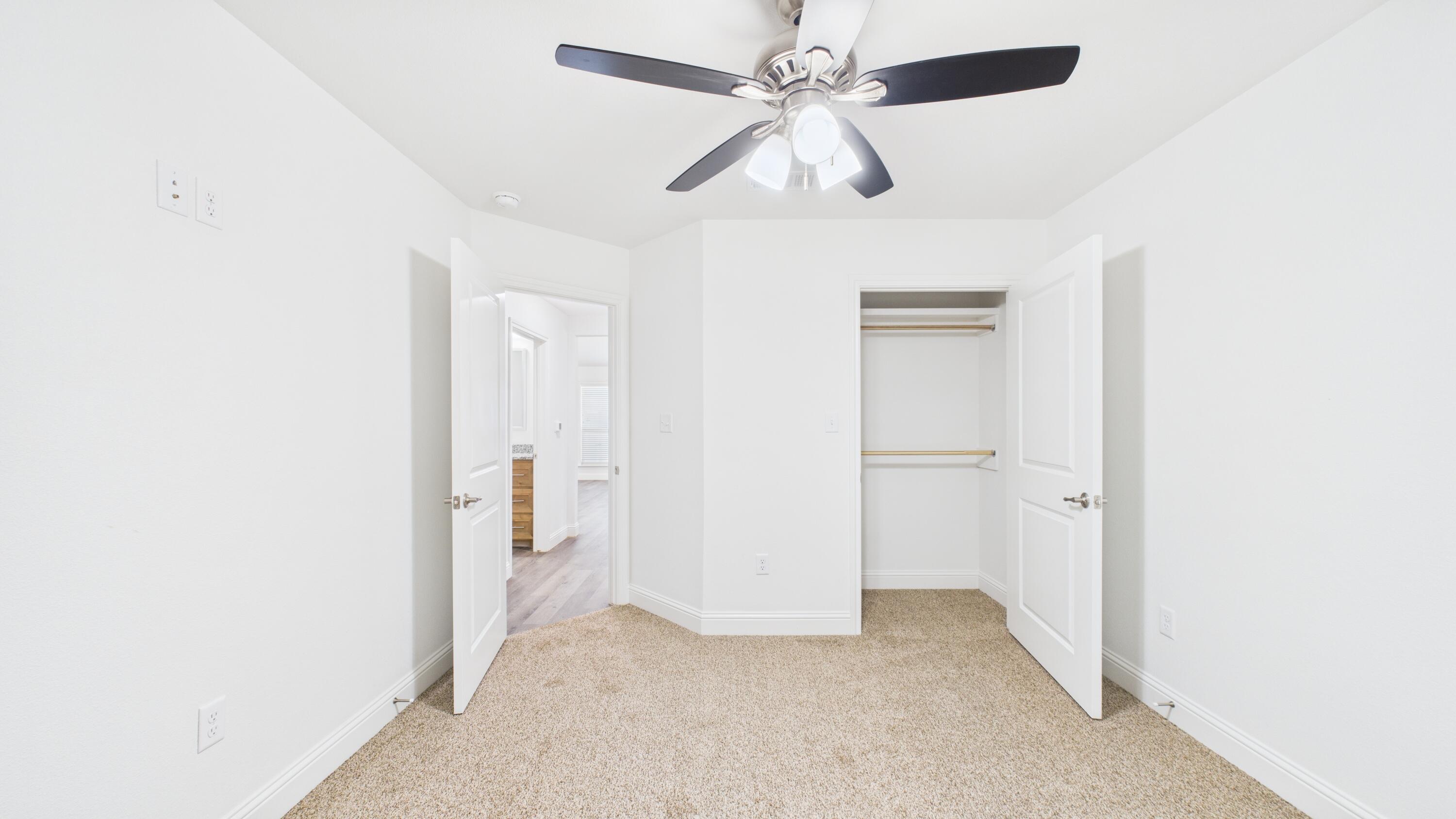 7107 23rd Street Lubbock, TX 79407 - Photo 34 of 49 a view of an empty room with a ceiling fan