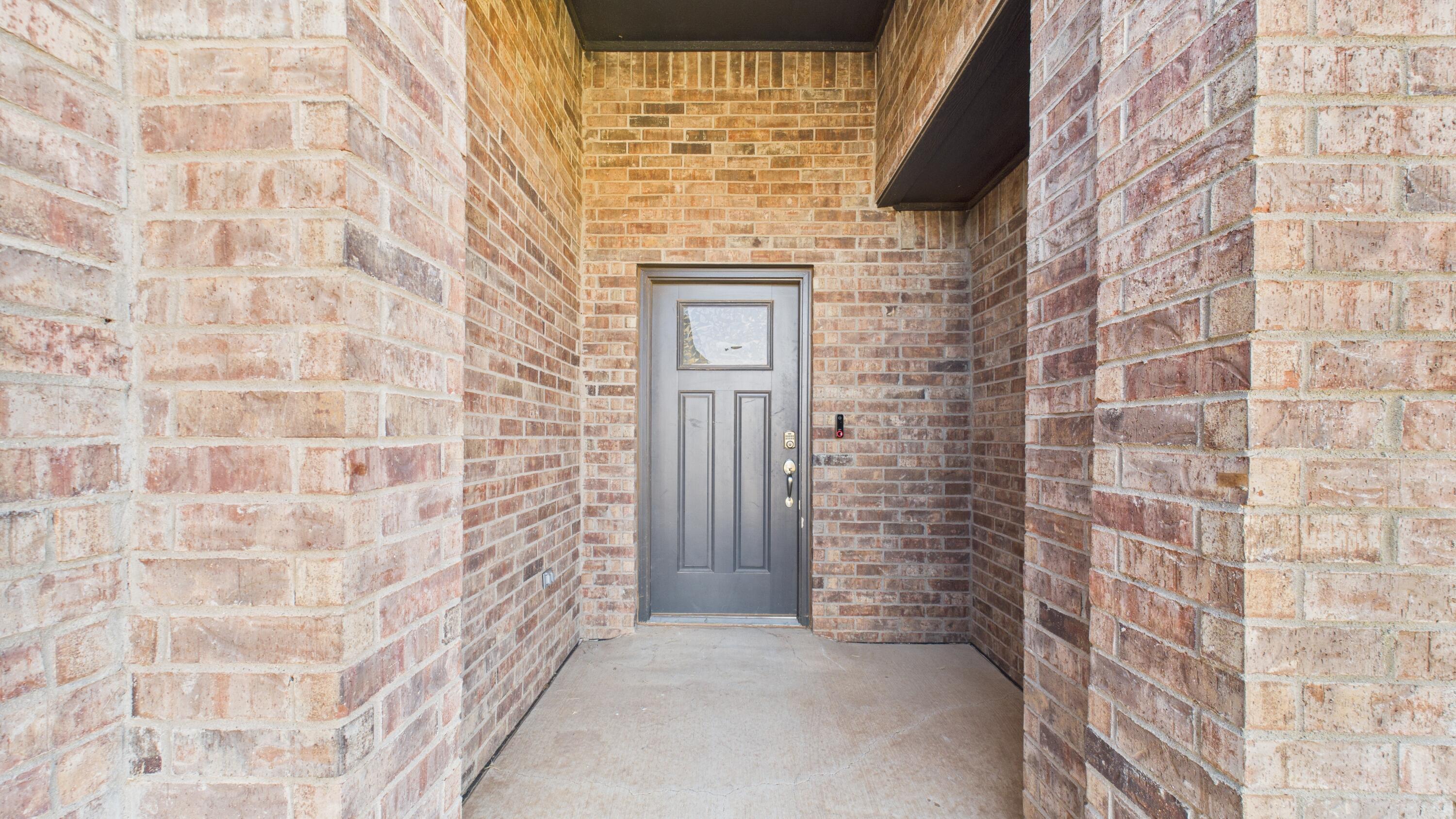 7107 23rd Street Lubbock, TX 79407 - Photo 10 of 49 a bathroom with a shower and a sink