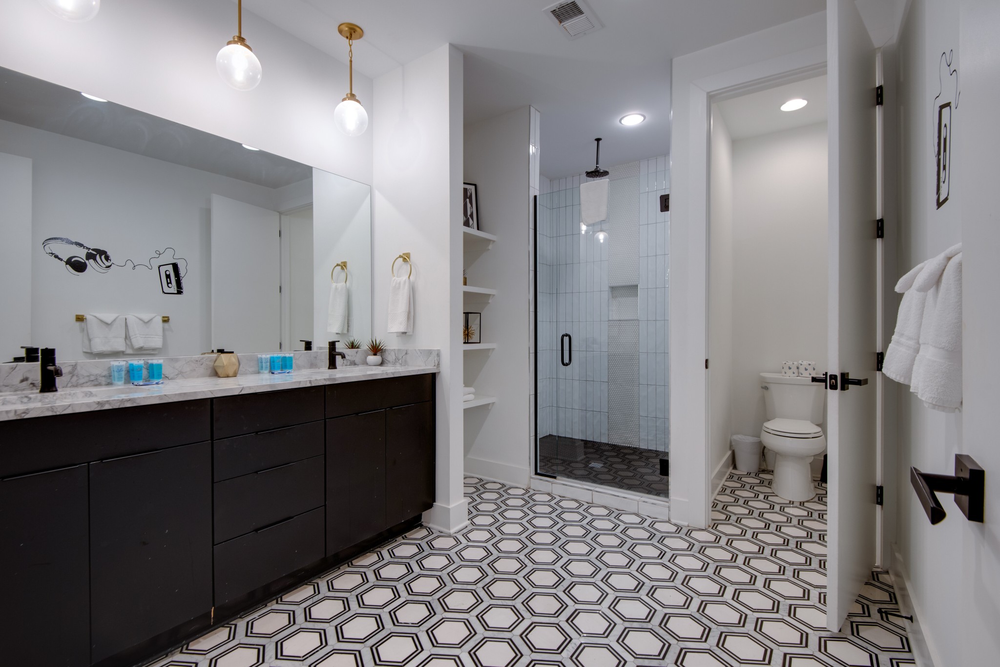 2809 Delaware Avenue, Unit 202 Nashville, TN 37209 - Photo 12 of 40 a bathroom with a sink a toilet and shower
