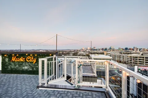 a view of a balcony with city view