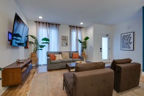 a living room with furniture and a lamp