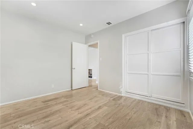 a bathroom with a bathtub sink vanity and mirror