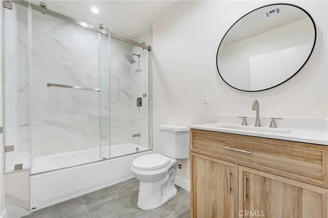 a view of a bedroom with washer and dryer