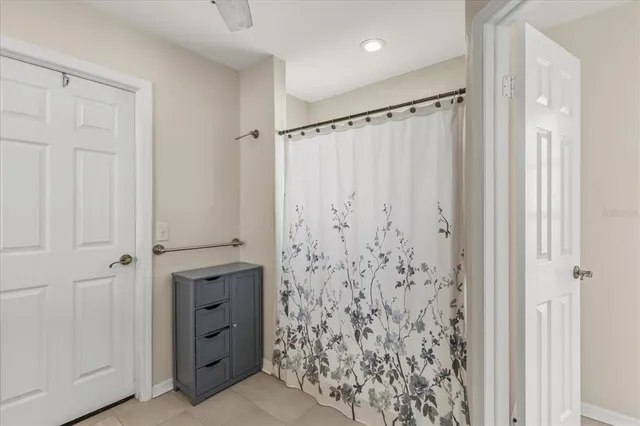 a bathroom with a shower and a shower curtain