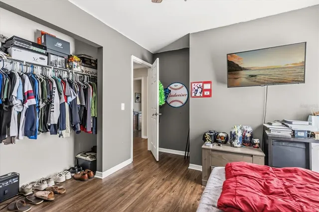 a bedroom with a bed and a closet