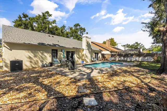 a view of a house with basketball court