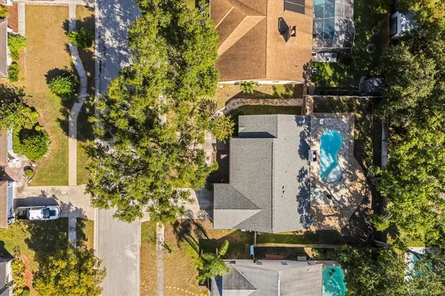front view of a house with a tree