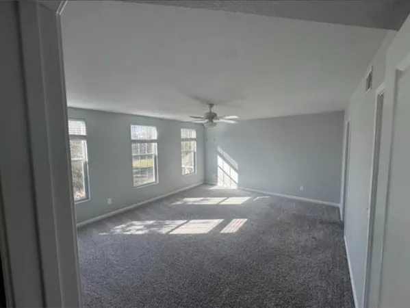 a view of empty room with windows