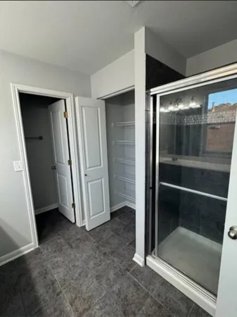 an empty room with sliding door