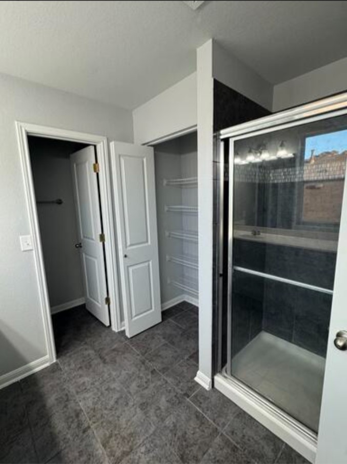 411 Wetzel Kyle, TX 78640 - Photo 22 of 28 an empty room with sliding door