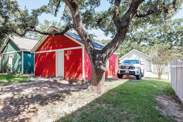 a view of a house with a yard and sitting area