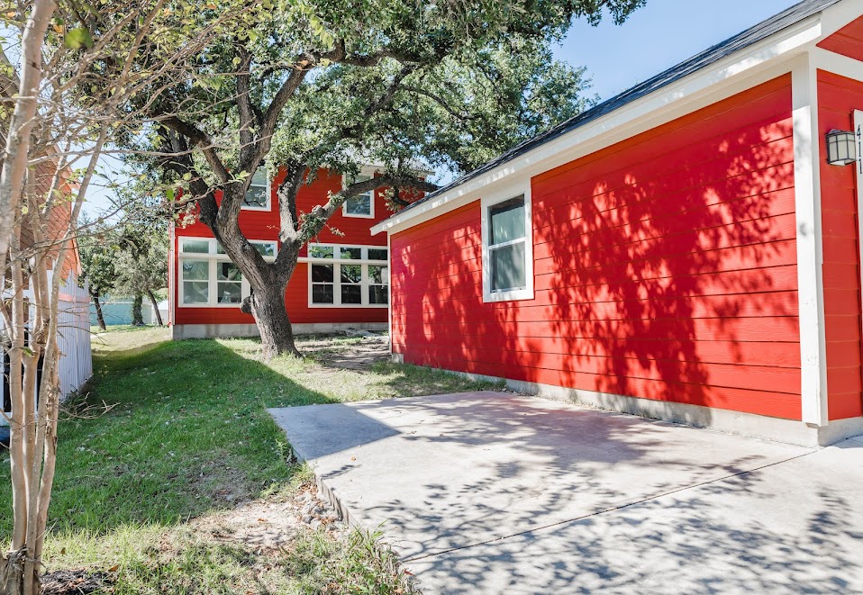 411 Wetzel Kyle, TX 78640 - Photo 4 of 28 a view of a house with a yard