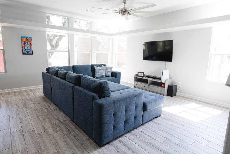 411 Wetzel Kyle, TX 78640 - Photo 5 of 28 a living room with furniture and a flat screen tv