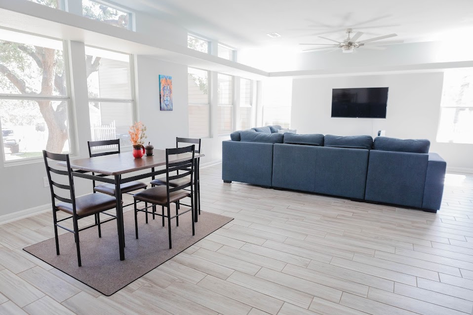 411 Wetzel Kyle, TX 78640 - Photo 7 of 28 a living room with furniture a flat screen tv and a window