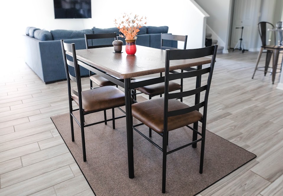 411 Wetzel Kyle, TX 78640 - Photo 8 of 28 a dining room with furniture and wooden floor