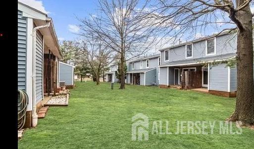 4806 Hana Road Edison, NJ 08817 - Photo 3 of 4 a front view of a house with a garden