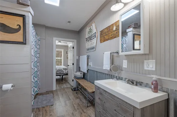 a bathroom with a sink and a mirror