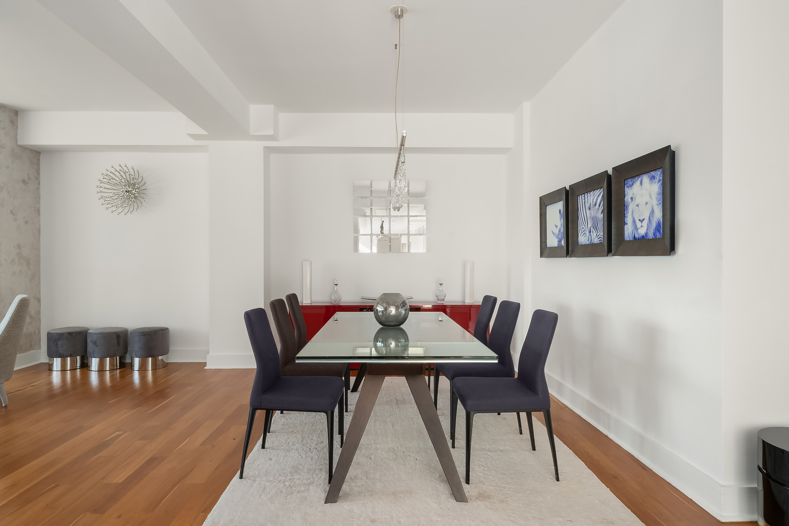 426 West 58th Street, Unit PH3 Manhattan, NY 10019 - Photo 9 of 22 a view of a dining room with furniture and wooden floor