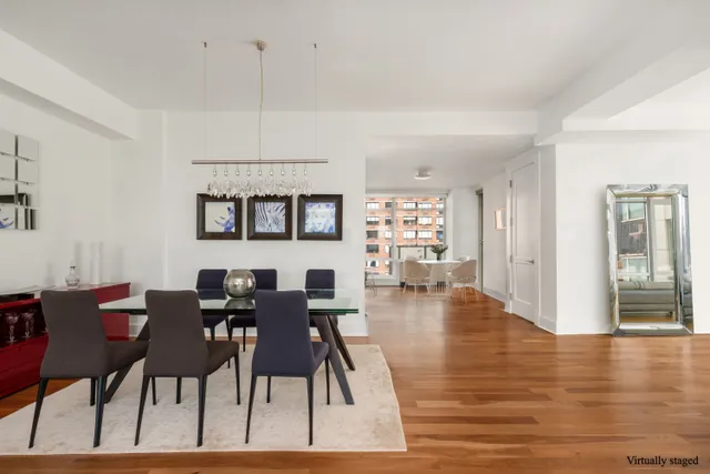 a living room with kitchen island furniture and a large window