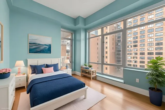 a bedroom with a bed and a couch