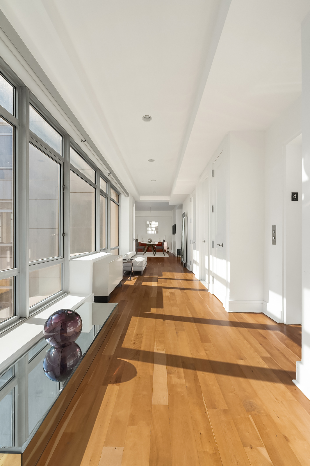 426 West 58th Street, Unit PH3 Manhattan, NY 10019 - Photo 4 of 22 a view of living room filled with furniture windows