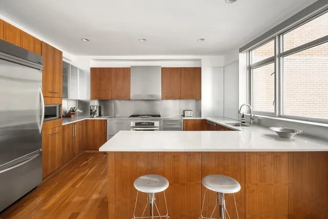 a view of living room filled with furniture windows