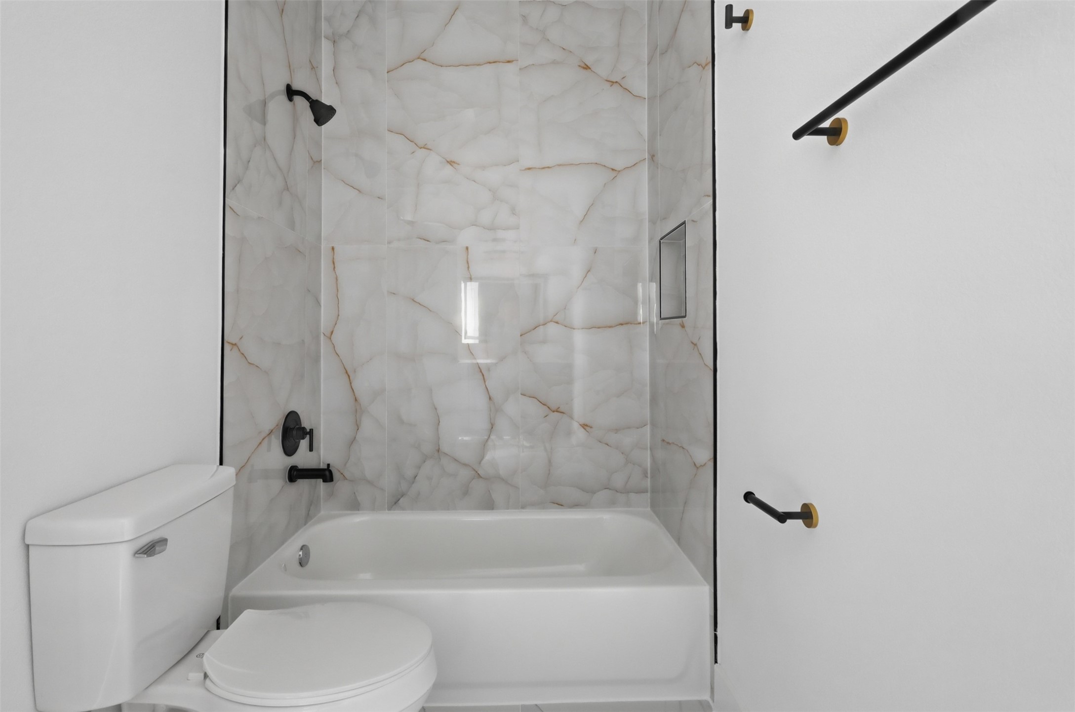 4606 Mallow Street, Unit A Houston, TX 77051 - Photo 17 of 21 a bathroom with a bathtub and a toilet